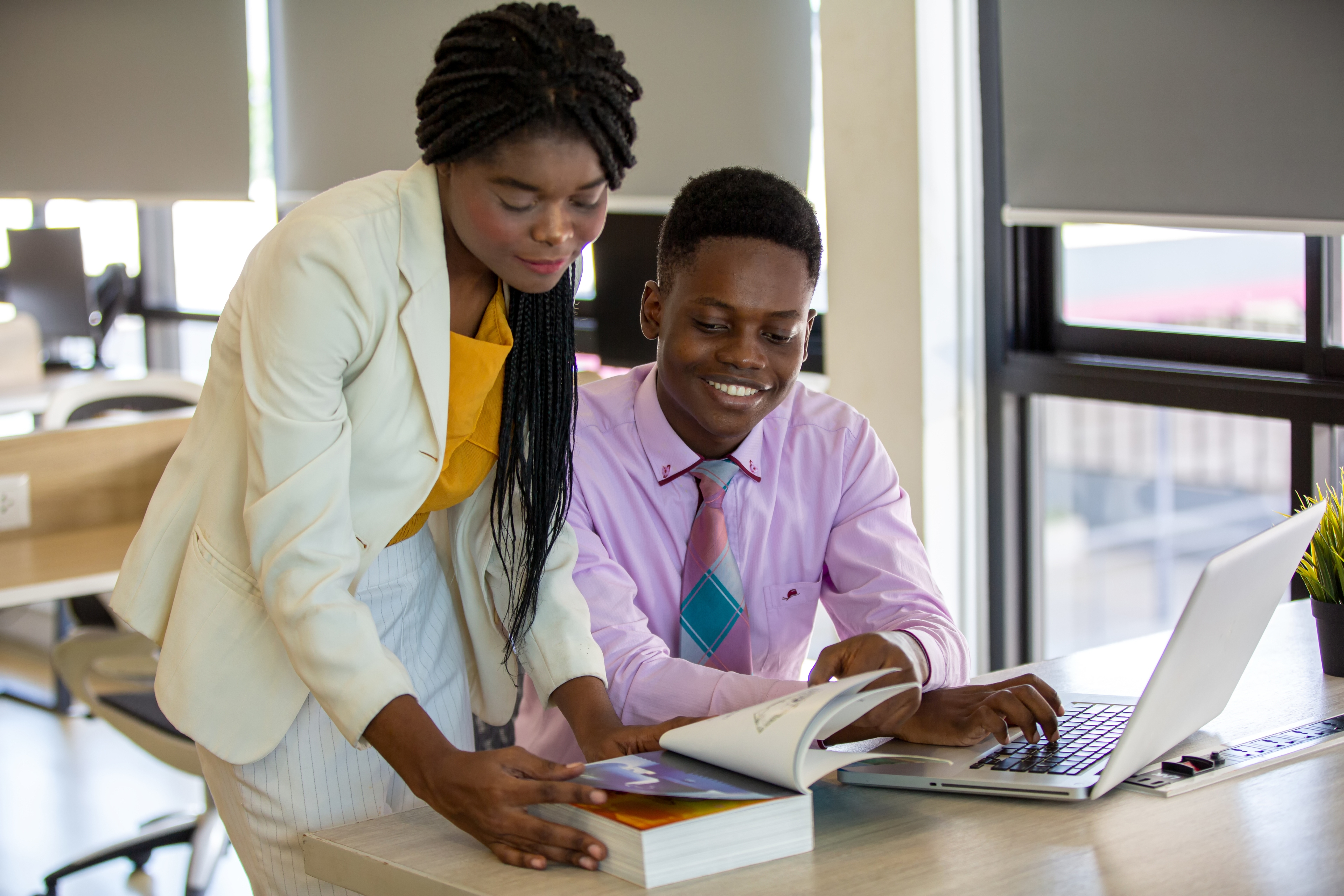 Teacher helping student