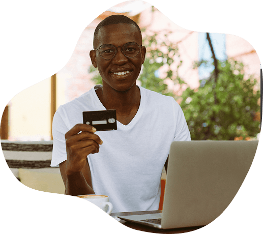 Student with laptop and credit card